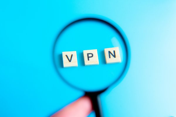 vpn services best 2020 magnifying glass over vpn written from cubes blue background